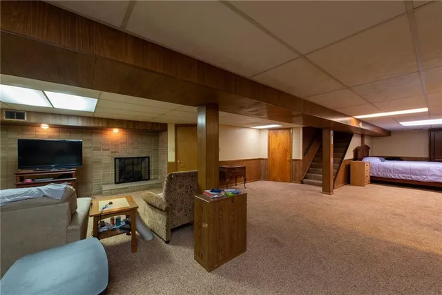 a view of a livingroom with furniture and a flat screen tv