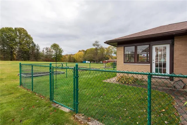 a view of a golf course with a lake view