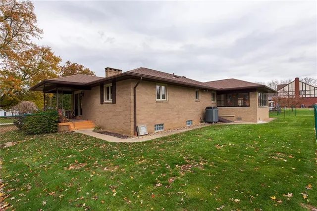 a view of a lake with houses in the back