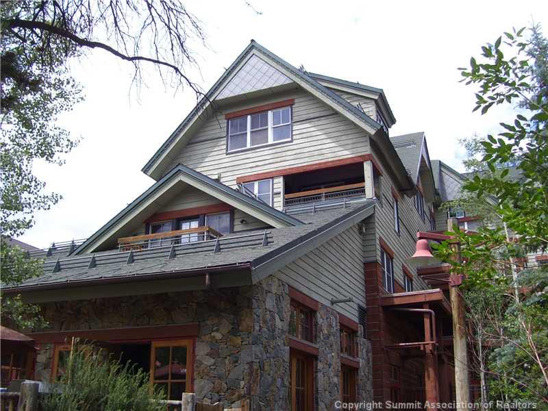 195 River Run Road, Unit 8012 Keystone, CO 80435 - Photo 2 of 19 a view of house with a small yard and a large tree
