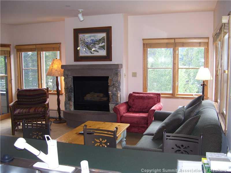 195 River Run Road, Unit 8012 Keystone, CO 80435 - Photo 4 of 19 a living room with furniture and a fireplace