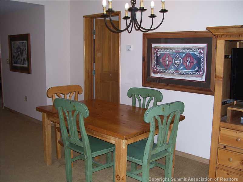 195 River Run Road, Unit 8012 Keystone, CO 80435 - Photo 6 of 19 a view of a dining room with furniture and window