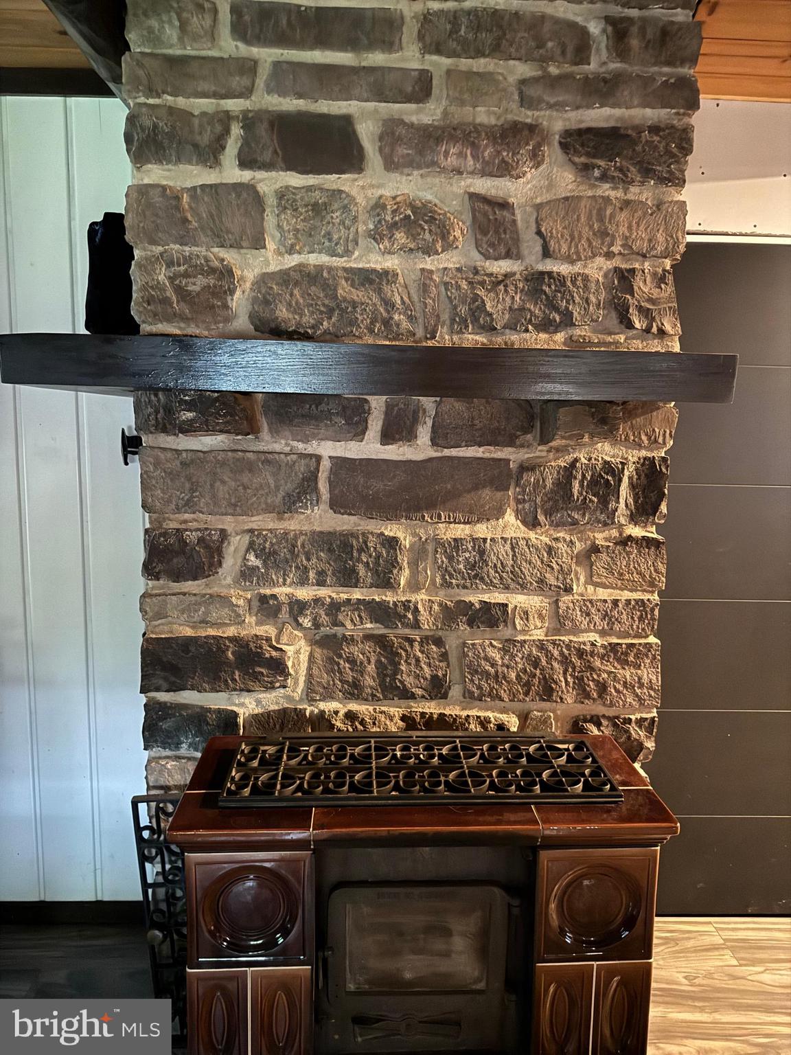 172 Stone Road Barto, PA 19504 - Photo 11 of 16 Porcelain German Wood Stove in Great Room w/ Stone