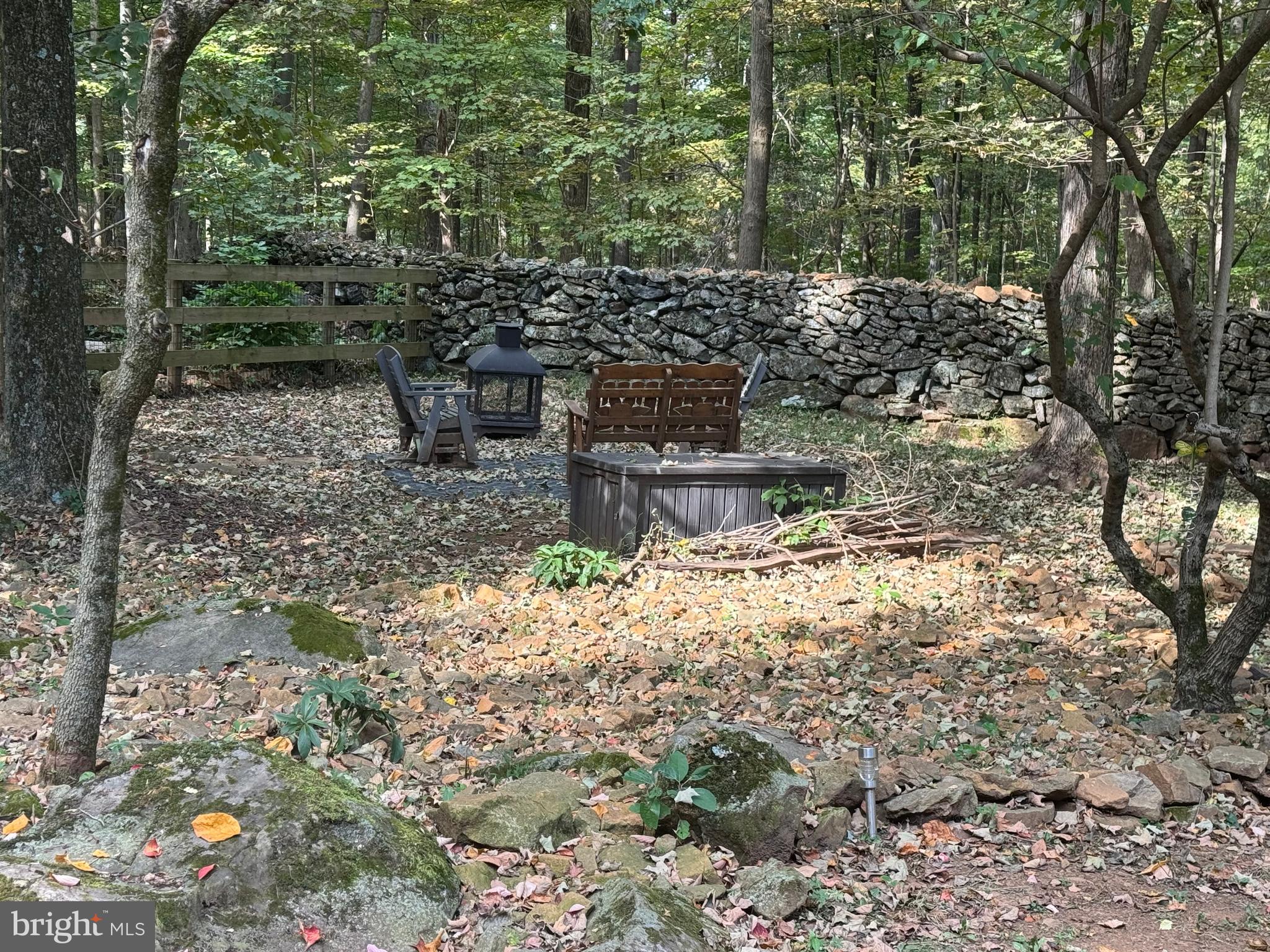 172 Stone Road Barto, PA 19504 - Photo 7 of 16 Firepit sitting area surrounded by nature.