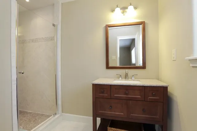a bathroom with a sink and a mirror
