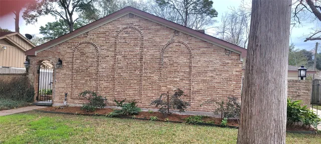 a view of house with backyard