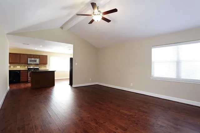 a view of kitchen with wooden floor and window