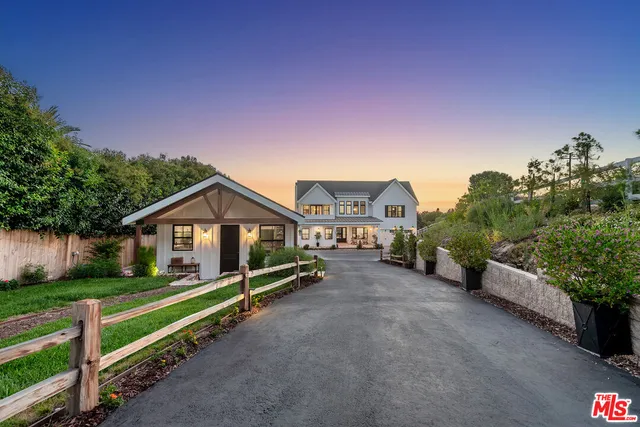a house view with a garden space