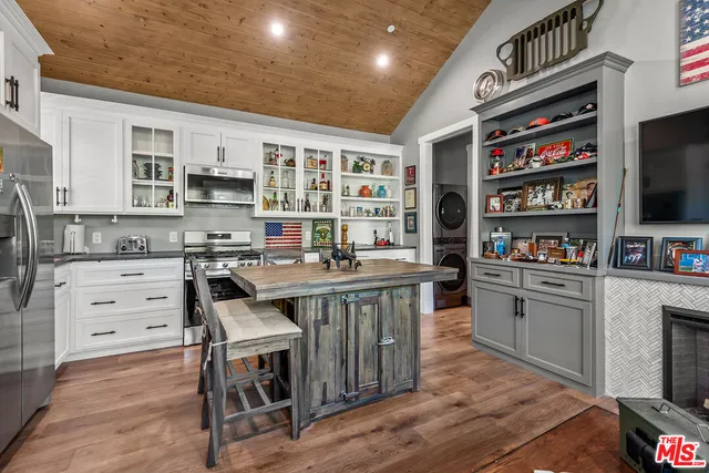 a kitchen with stainless steel appliances a stove and a refrigerator
