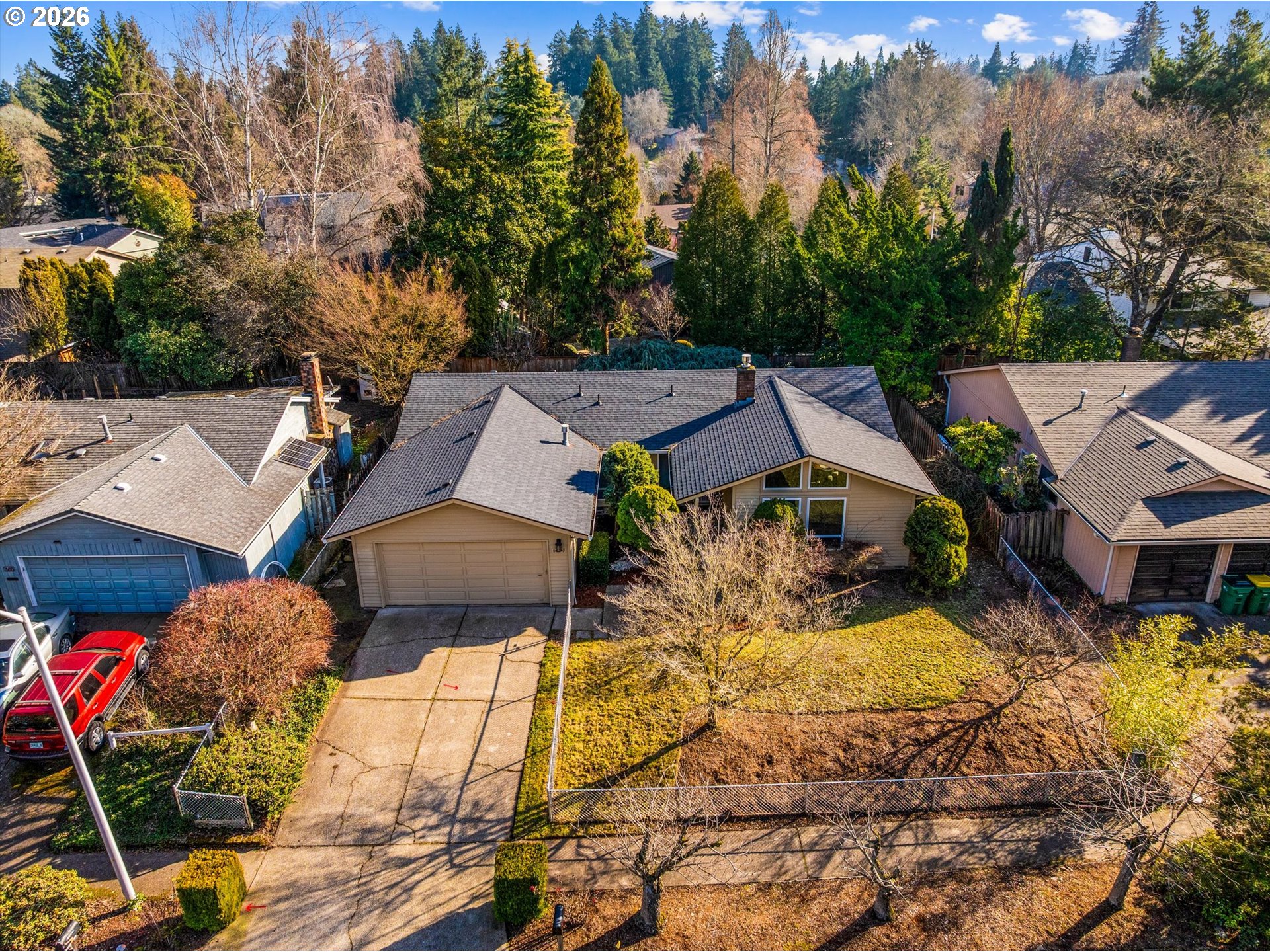 6740 Southwest Hyland Way Beaverton, OR 97008 - Photo 1 of 38 an aerial view of a house with swimming pool and large trees
