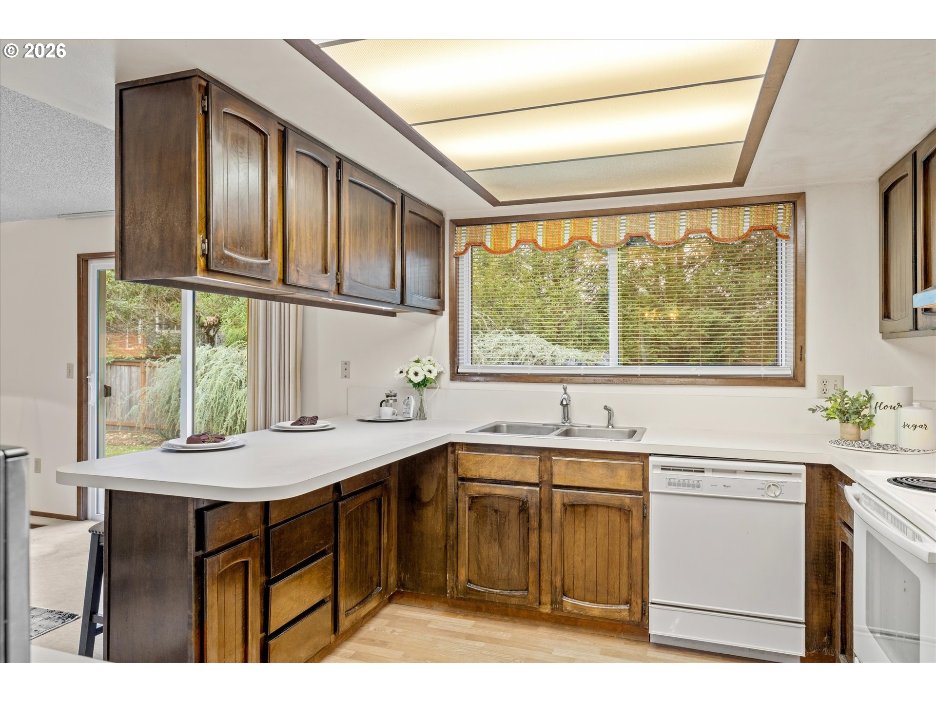6740 Southwest Hyland Way Beaverton, OR 97008 - Photo 13 of 38 a kitchen with a sink and large window