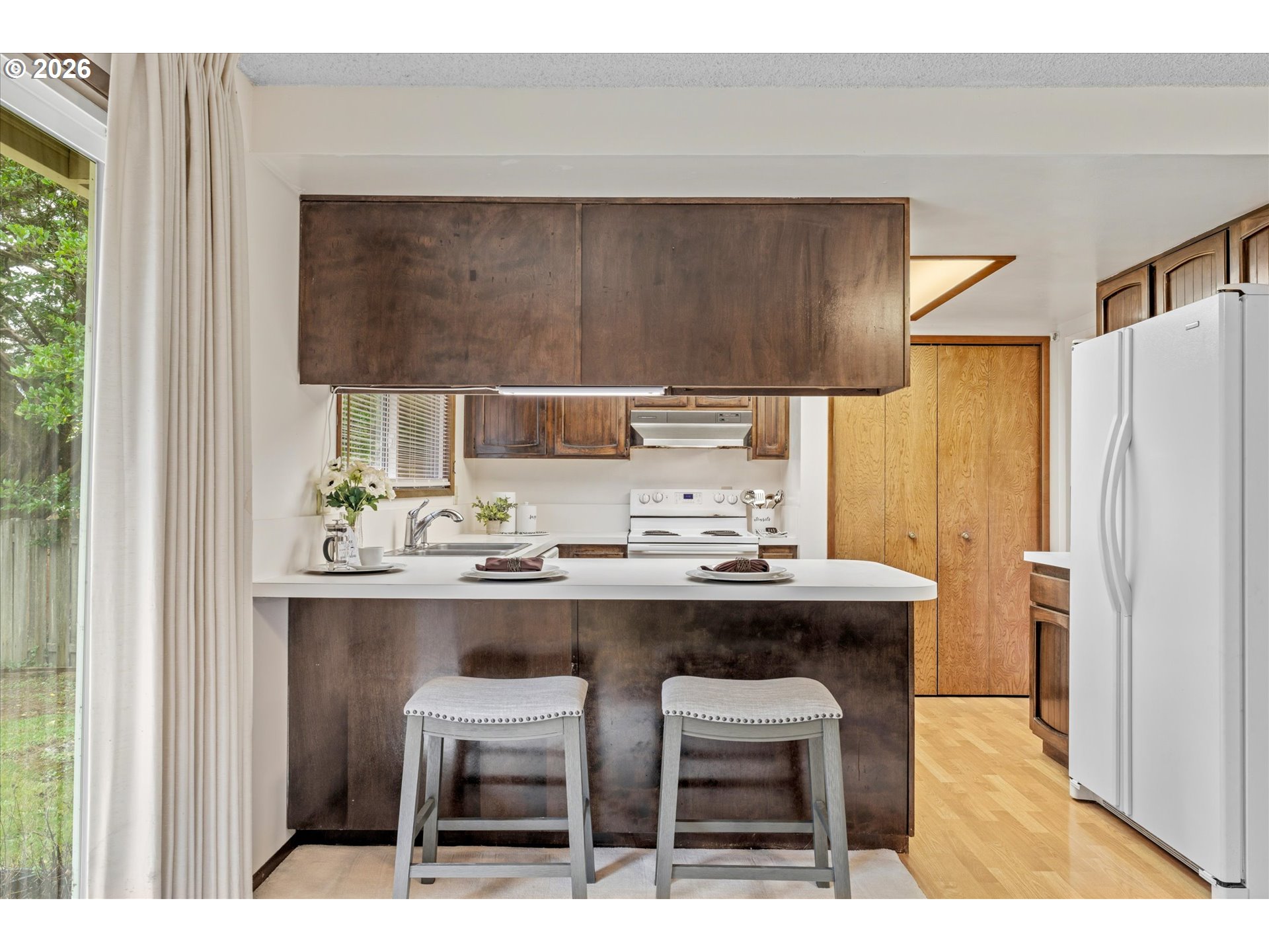 6740 Southwest Hyland Way Beaverton, OR 97008 - Photo 15 of 38 a kitchen with a sink cabinets and window