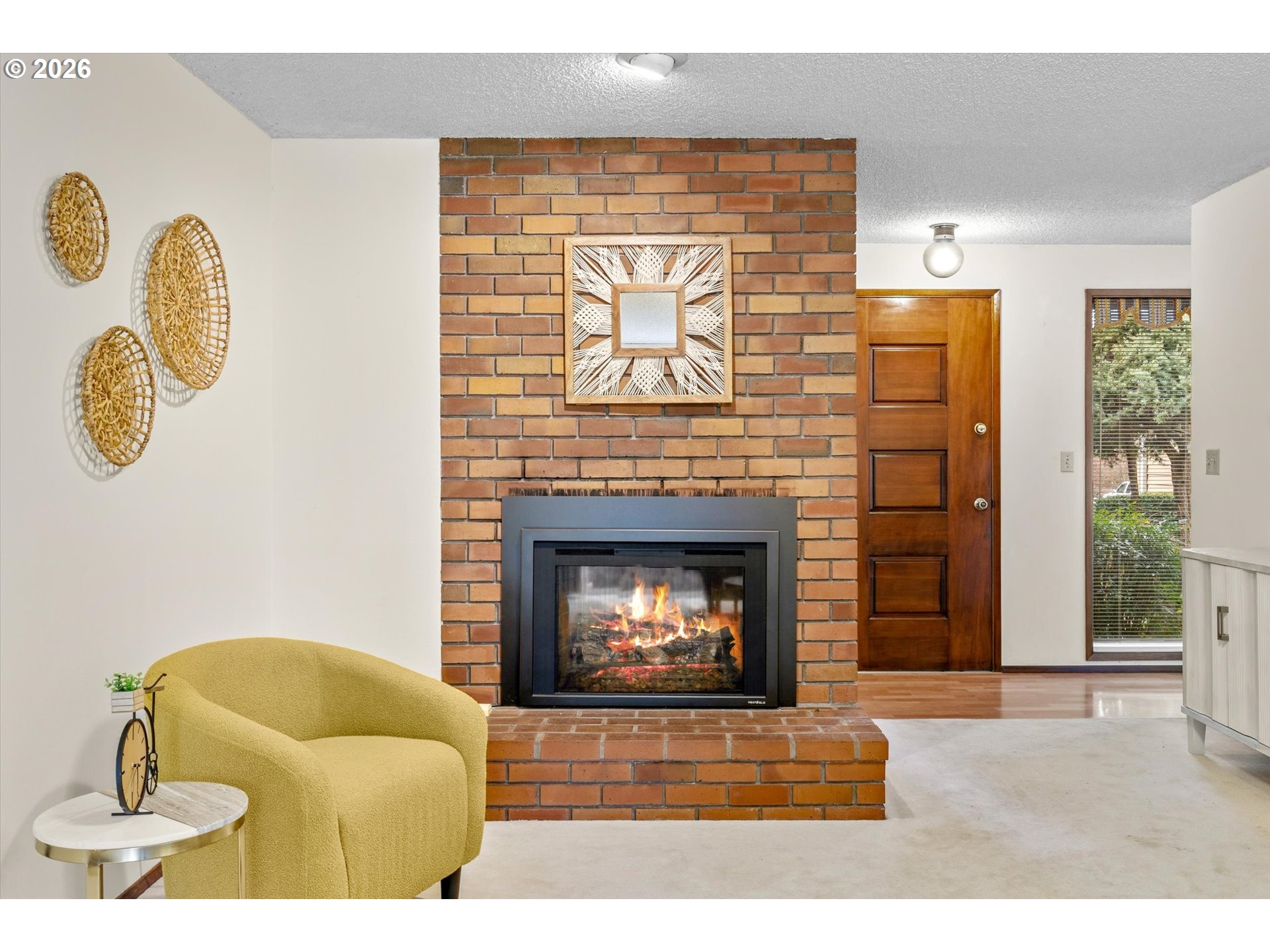 6740 Southwest Hyland Way Beaverton, OR 97008 - Photo 19 of 38 a living room with furniture and a fireplace