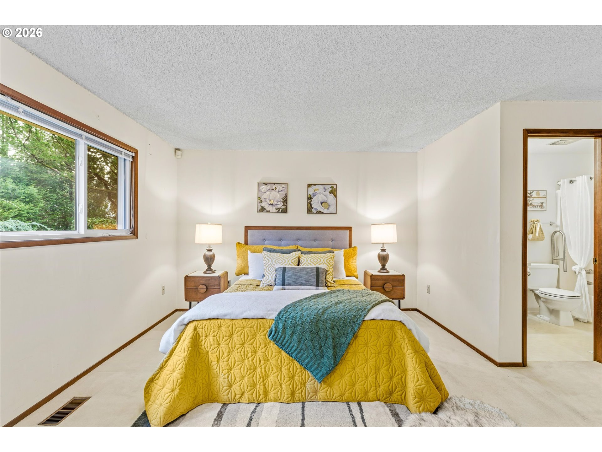 6740 Southwest Hyland Way Beaverton, OR 97008 - Photo 21 of 38 a bed sitting in a bedroom next to a window