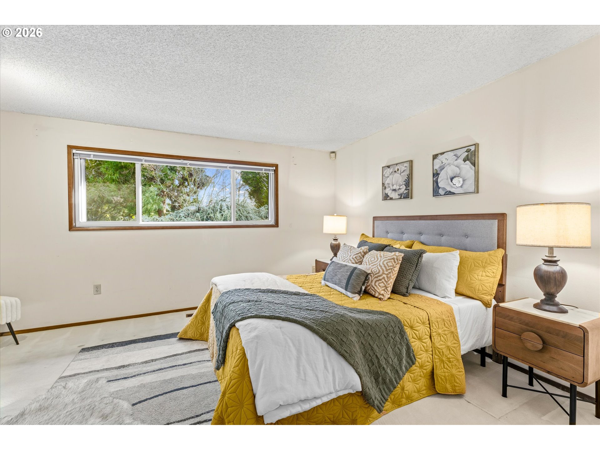 6740 Southwest Hyland Way Beaverton, OR 97008 - Photo 23 of 38 a bedroom with a bed and wooden floor