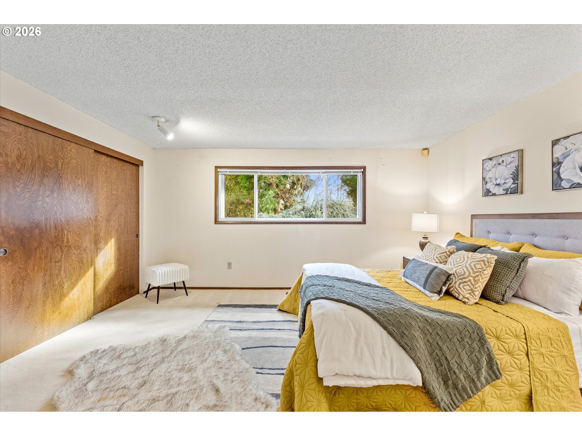 6740 Southwest Hyland Way Beaverton, OR 97008 - Photo 24 of 38 a bedroom with a bed and a painting on the wall
