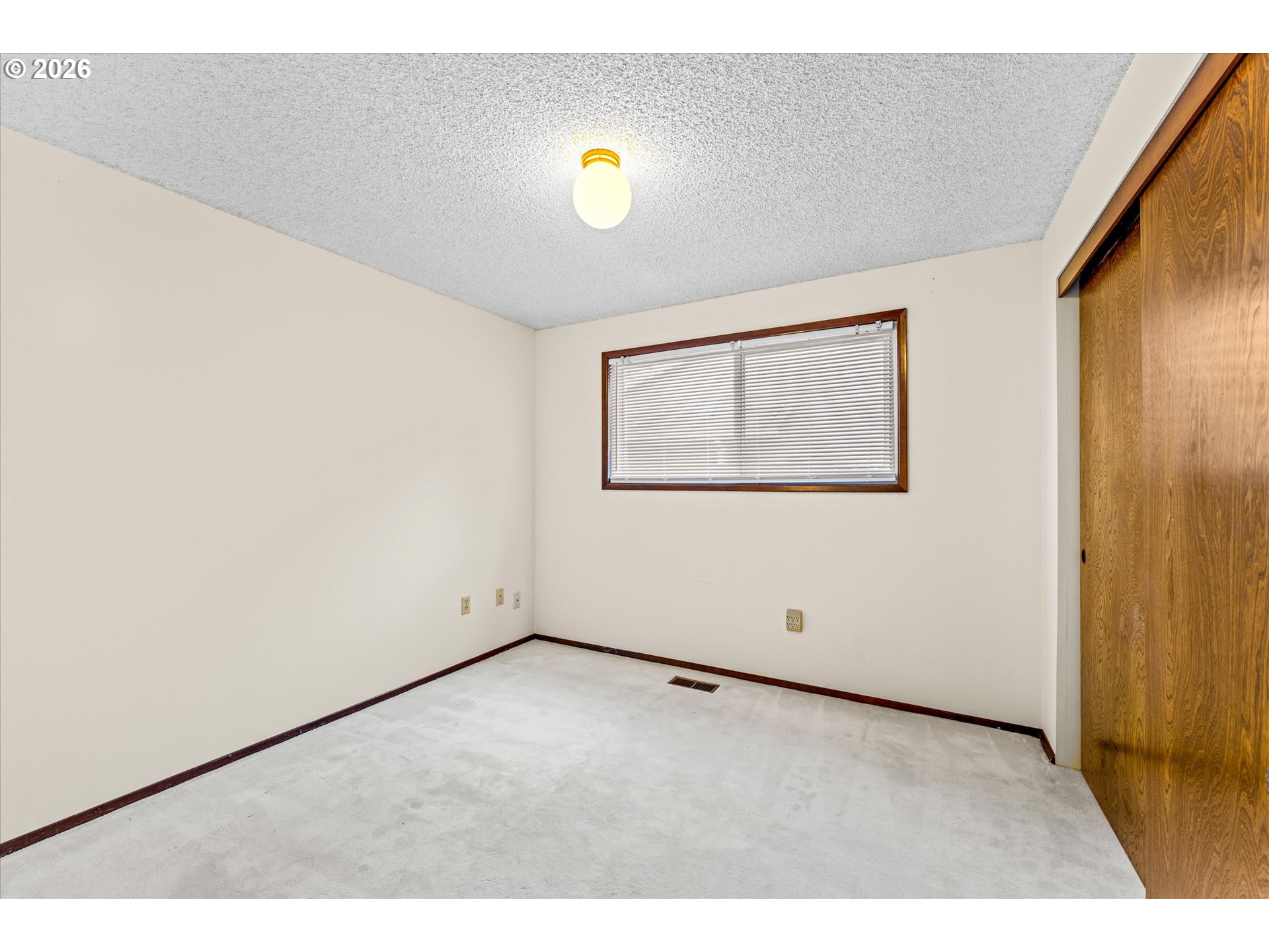 6740 Southwest Hyland Way Beaverton, OR 97008 - Photo 27 of 38 a view of empty room with wooden floor and windows