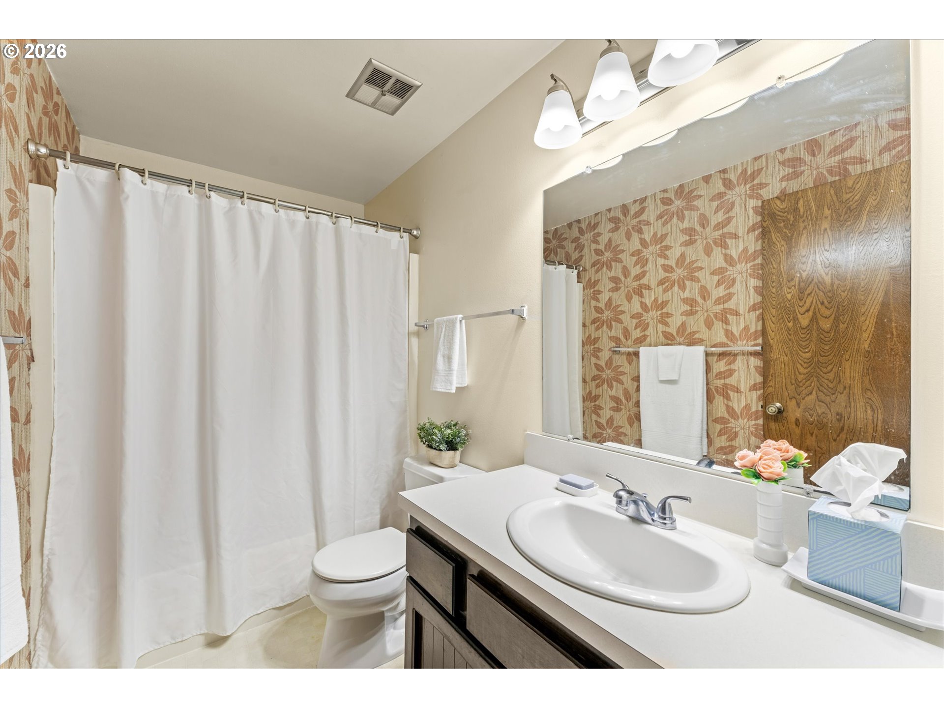6740 Southwest Hyland Way Beaverton, OR 97008 - Photo 28 of 38 a bathroom with a double vanity sink toilet and a mirror