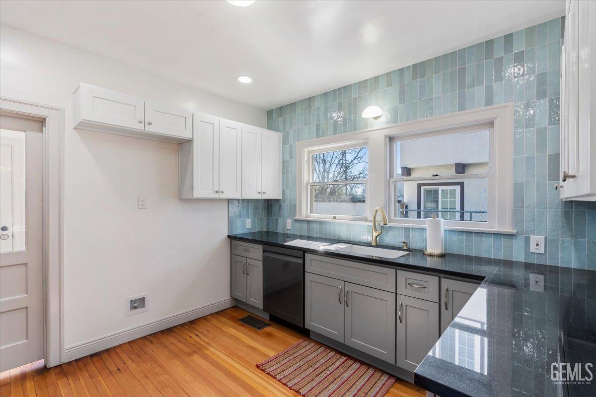 Undisclosed Address Bakersfield, CA 93305 - Photo 15 of 49 a kitchen with a sink cabinets and window
