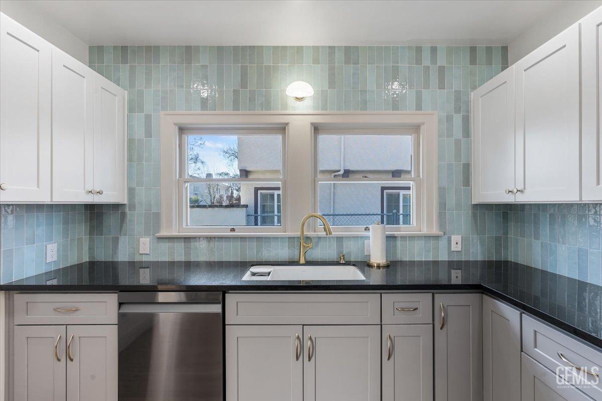 Undisclosed Address Bakersfield, CA 93305 - Photo 19 of 49 a kitchen with stainless steel appliances granite countertop a sink and cabinets