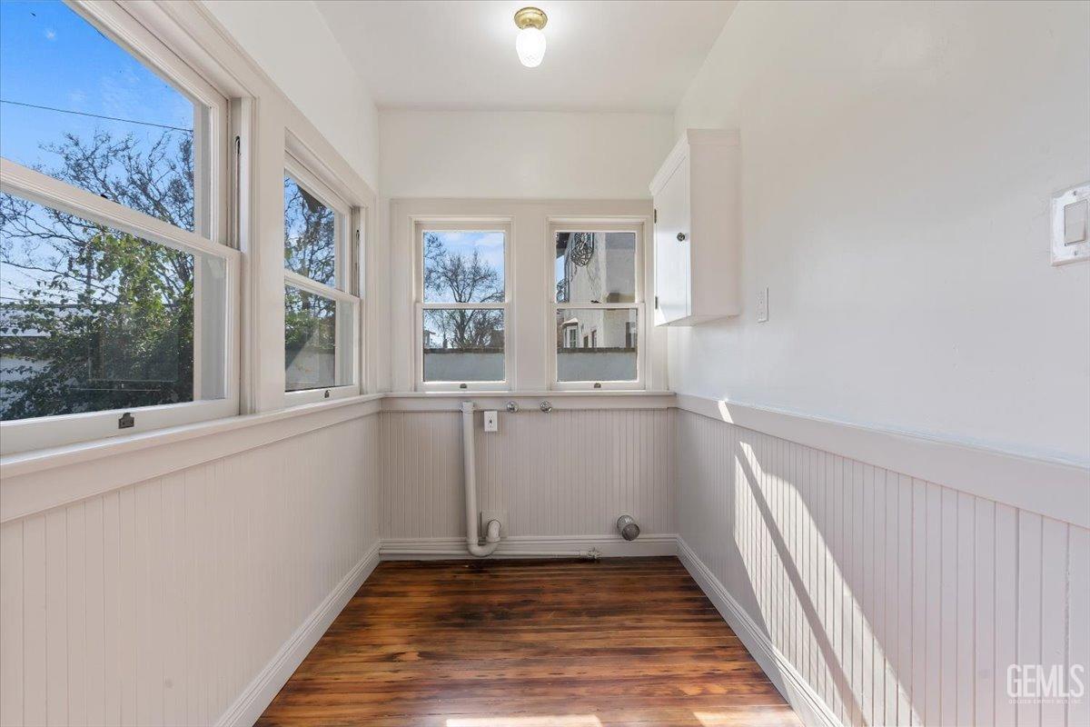 Undisclosed Address Bakersfield, CA 93305 - Photo 20 of 49 a view of an entryway with wooden floor and door