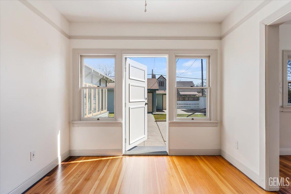Undisclosed Address Bakersfield, CA 93305 - Photo 23 of 49 a view of empty room with wooden floor and fan
