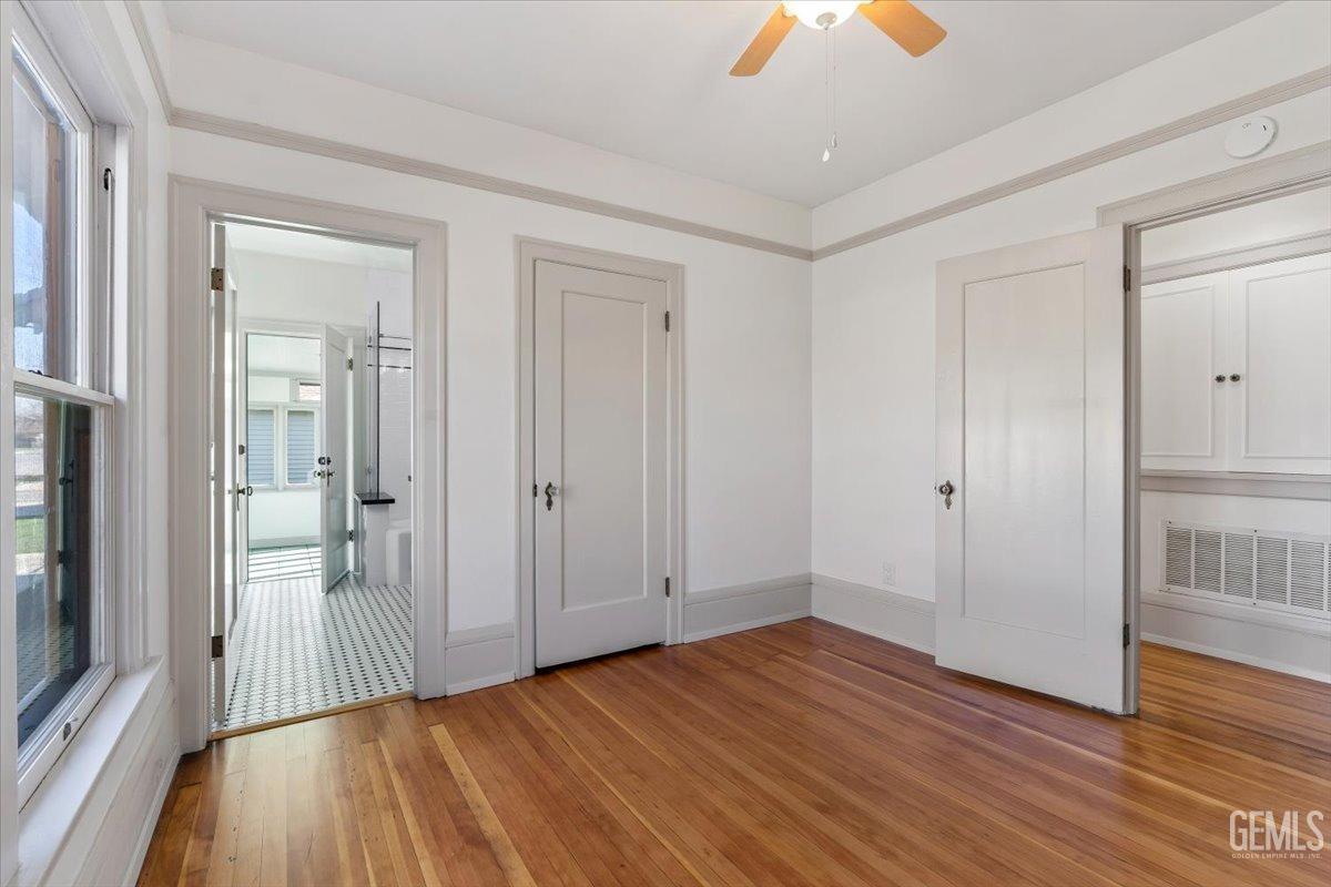 Undisclosed Address Bakersfield, CA 93305 - Photo 26 of 49 wooden floor in an empty room with a window