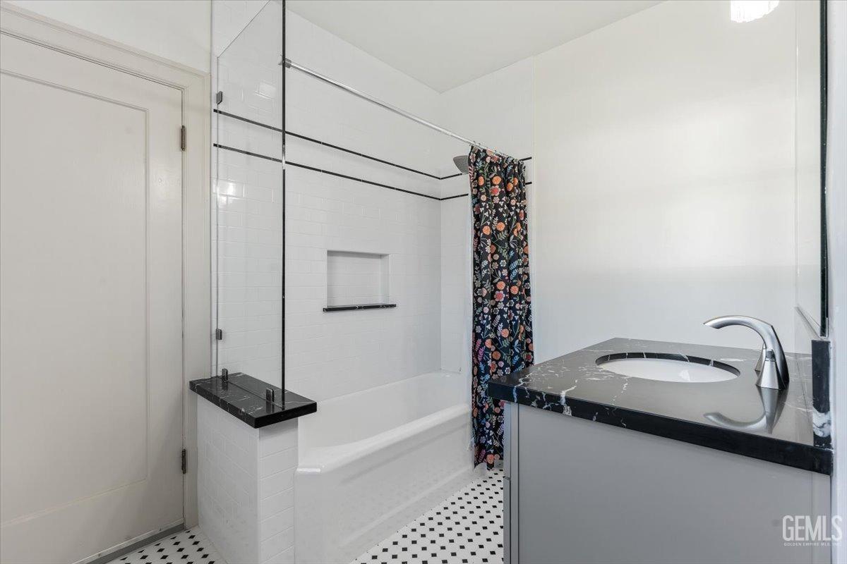 Undisclosed Address Bakersfield, CA 93305 - Photo 27 of 49 a bathroom with a sink and a shower