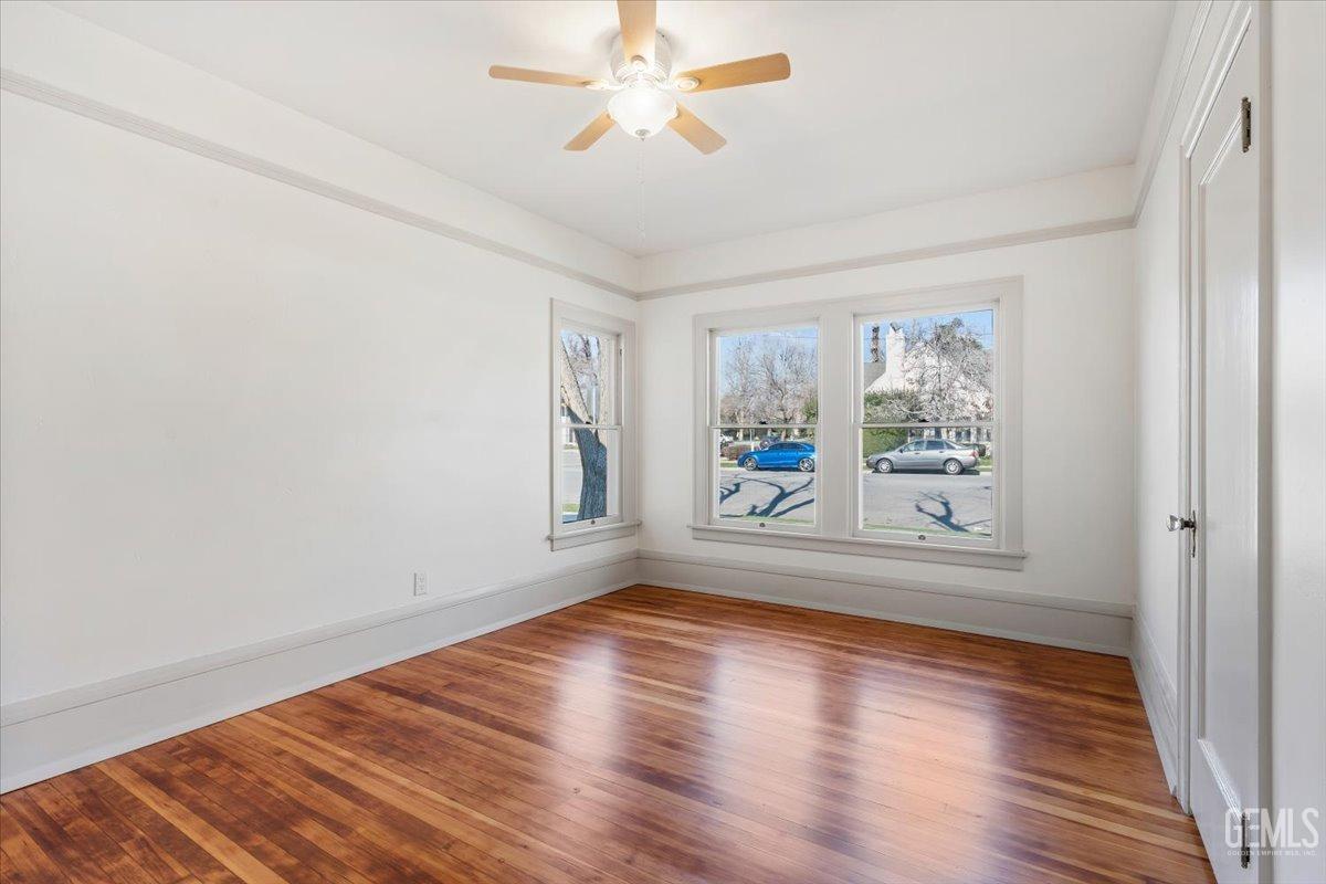 Undisclosed Address Bakersfield, CA 93305 - Photo 31 of 49 a view of empty room with wooden floor and fan