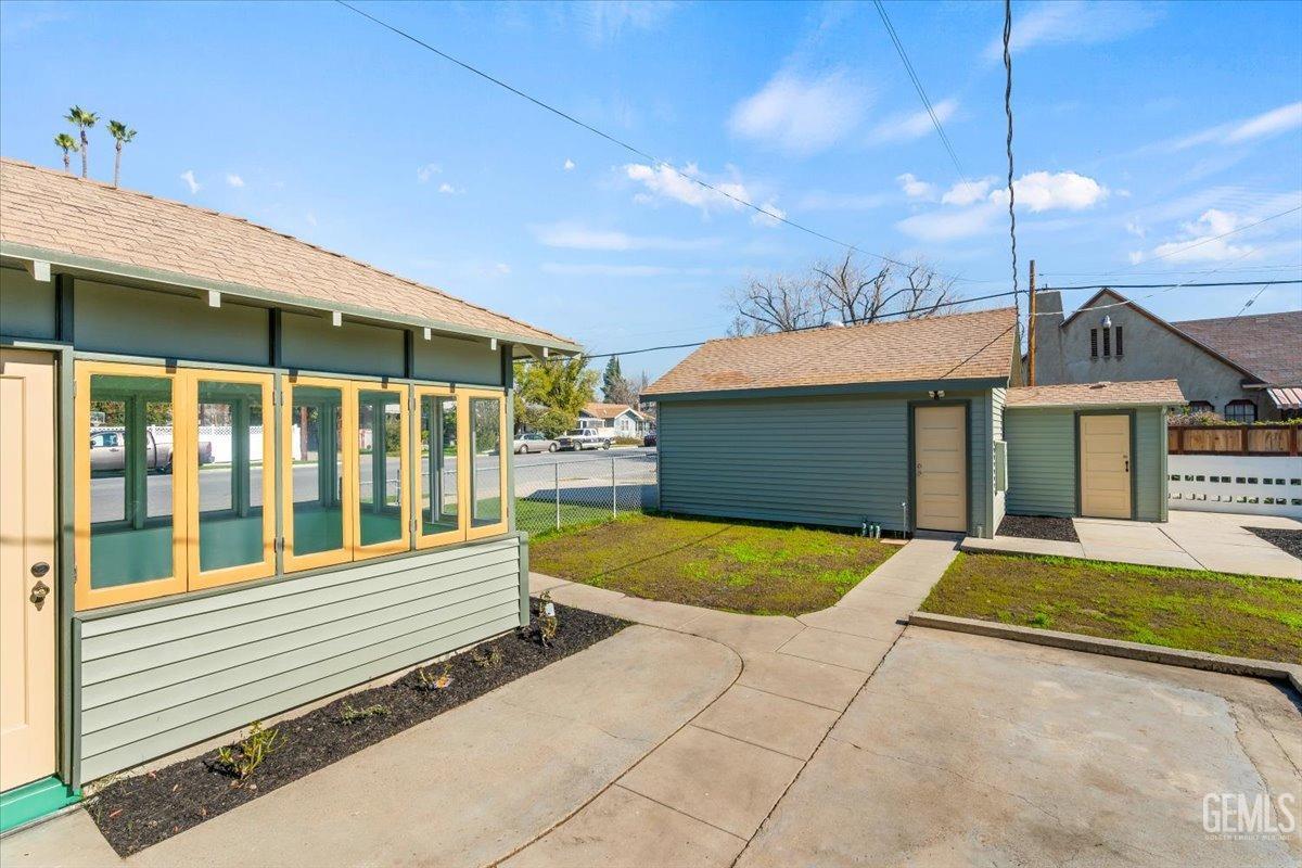 Undisclosed Address Bakersfield, CA 93305 - Photo 38 of 49 a front view of a house with a yard and garage