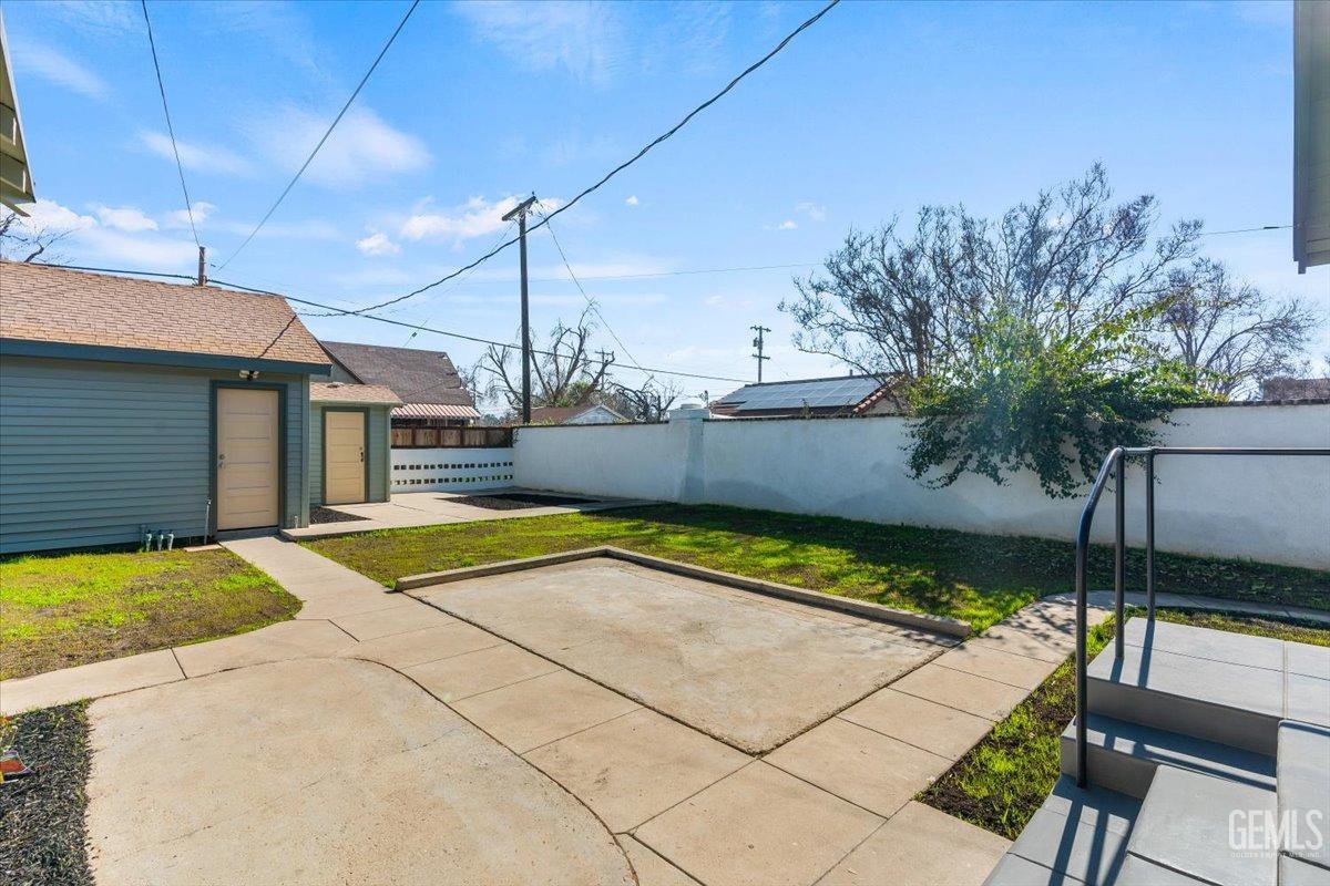 Undisclosed Address Bakersfield, CA 93305 - Photo 39 of 49 a view of a backyard with plants and a patio