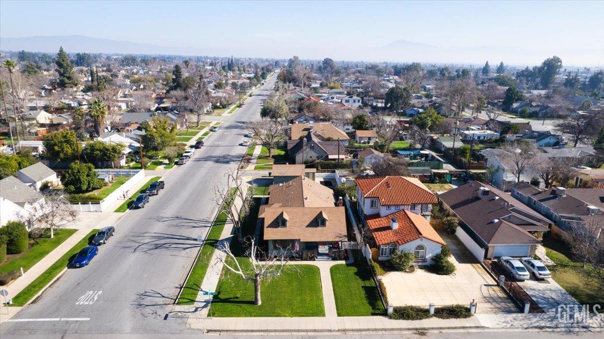 Undisclosed Address Bakersfield, CA 93305 - Photo 46 of 49 an aerial view of a residential apartment building with a yard