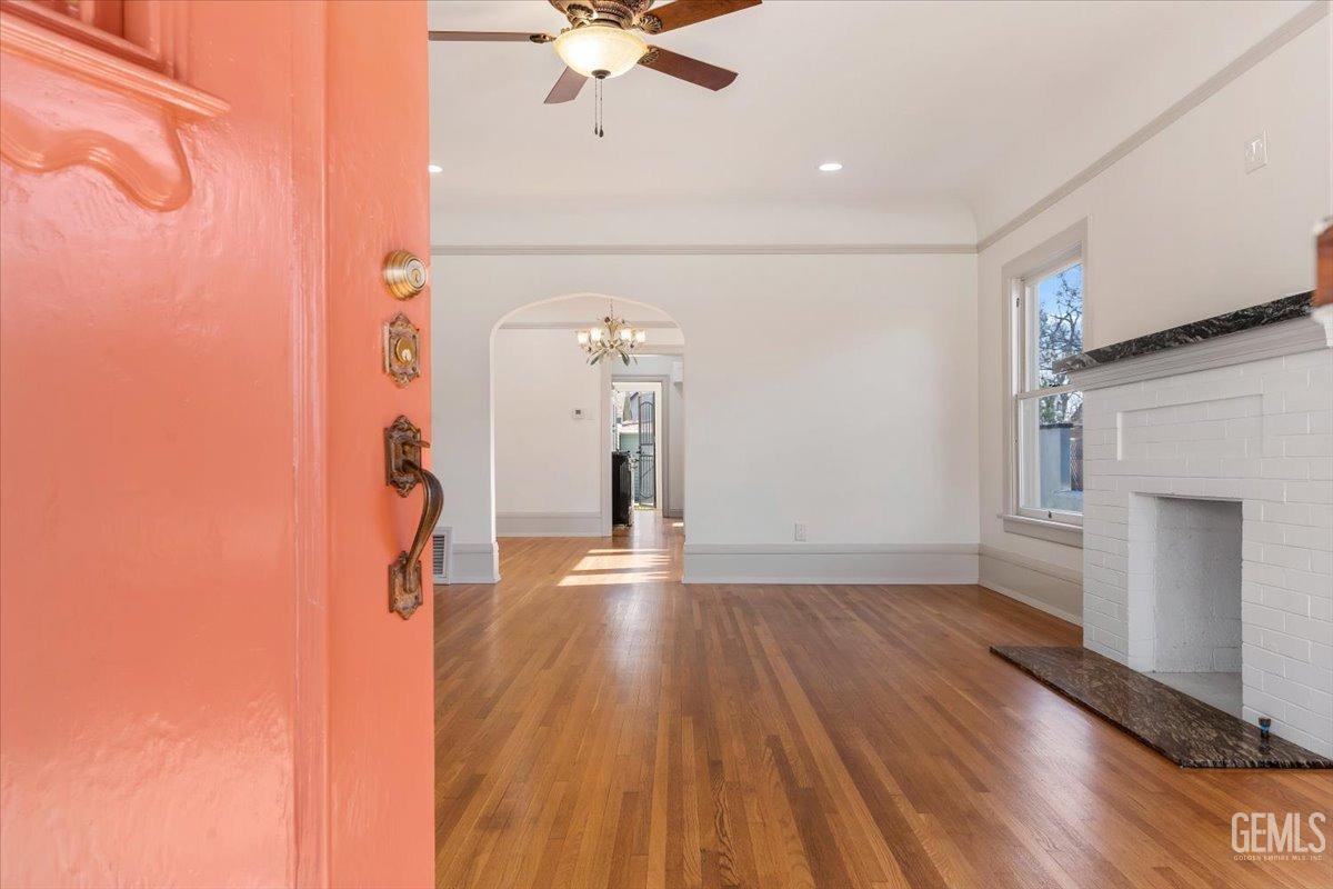Undisclosed Address Bakersfield, CA 93305 - Photo 9 of 49 a view of empty room with wooden floor and fan