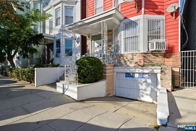 a view of a white building with many windows