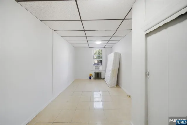 a view of a room with white walls