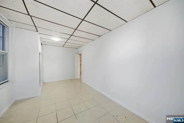 a view of livingroom with furniture and floor to ceiling window