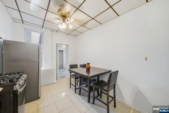a kitchen with stainless steel appliances a stove refrigerator sink and cabinets