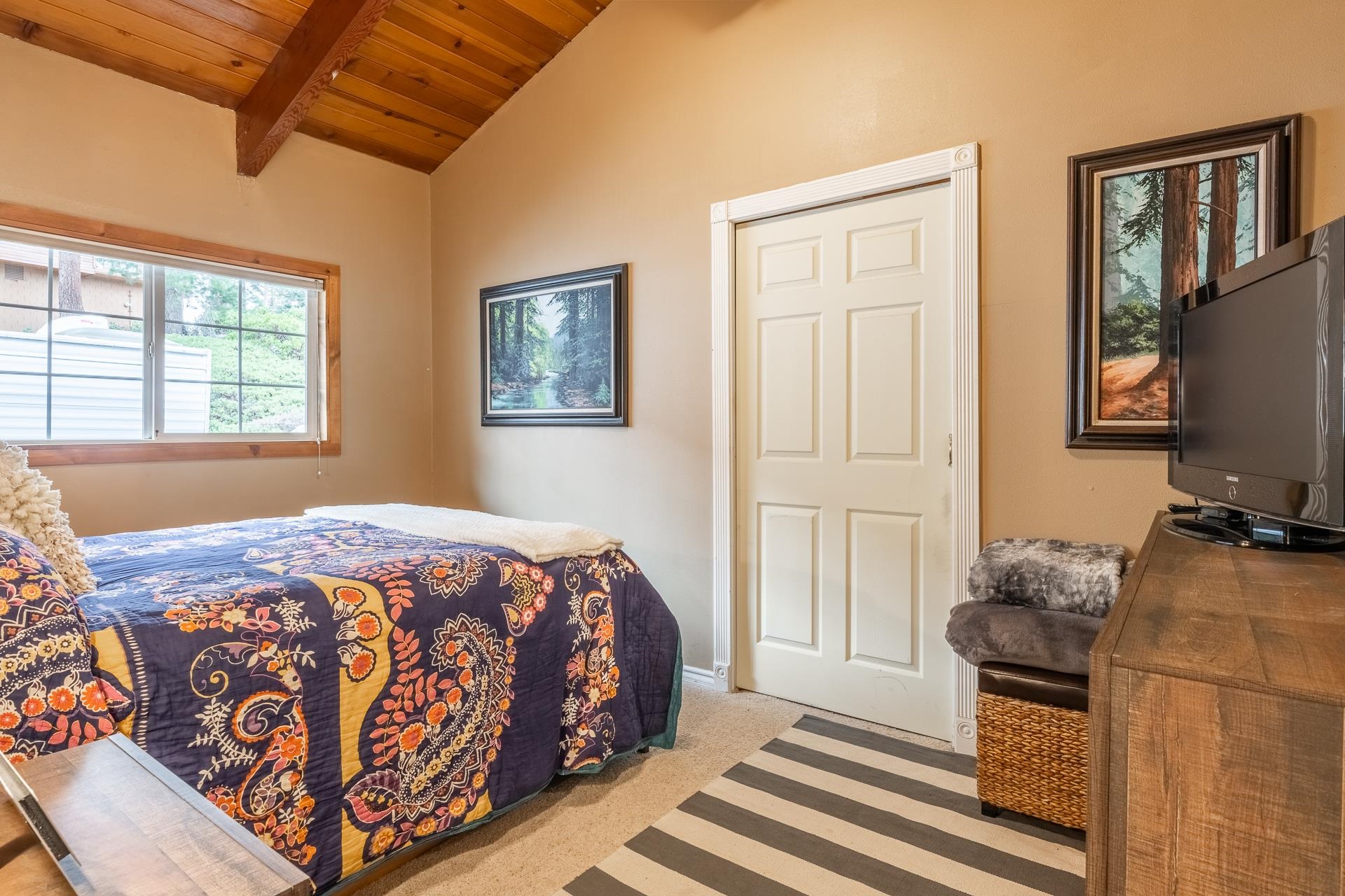 182 Davison Road Mammoth Lakes, CA 93546 - Photo 11 of 25 a bedroom with a bed and wooden floor