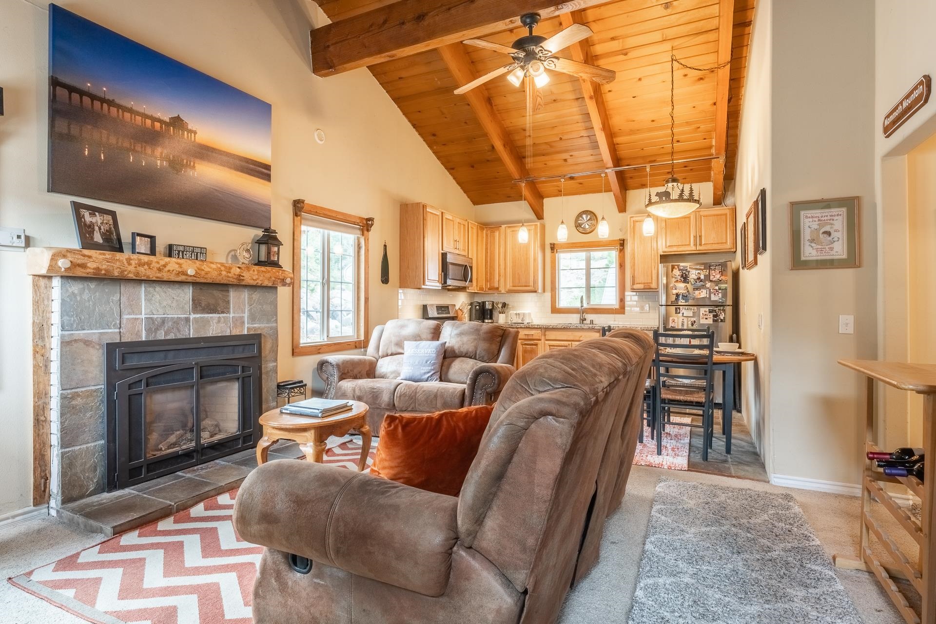 182 Davison Road Mammoth Lakes, CA 93546 - Photo 5 of 25 a living room with furniture a fireplace and a flat screen tv