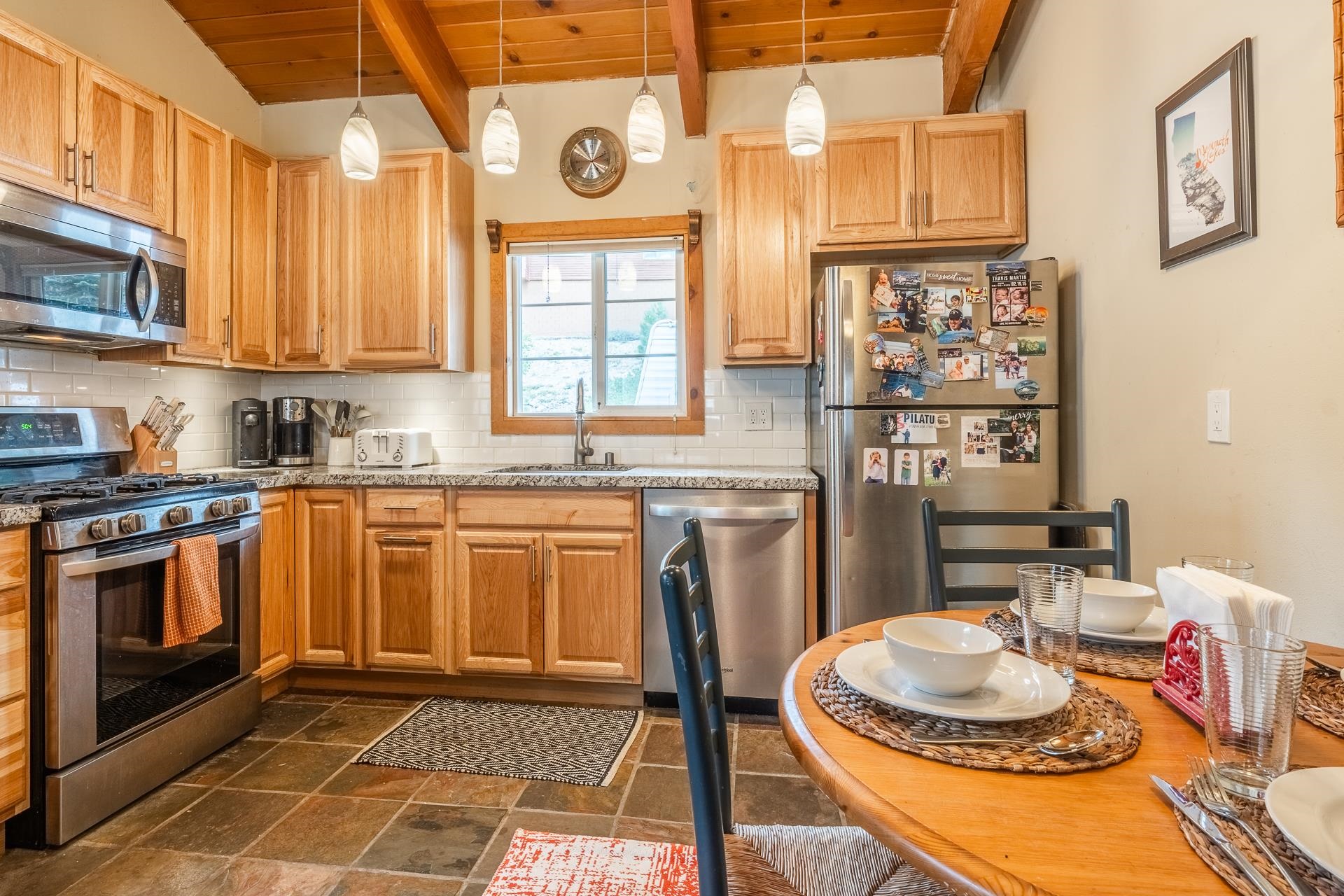 182 Davison Road Mammoth Lakes, CA 93546 - Photo 8 of 25 a kitchen with a sink a stove and a refrigerator