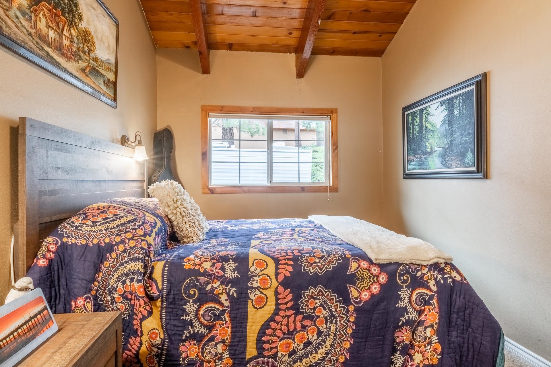 182 Davison Road Mammoth Lakes, CA 93546 - Photo 10 of 25 a bedroom with a bed and a painting on the wall