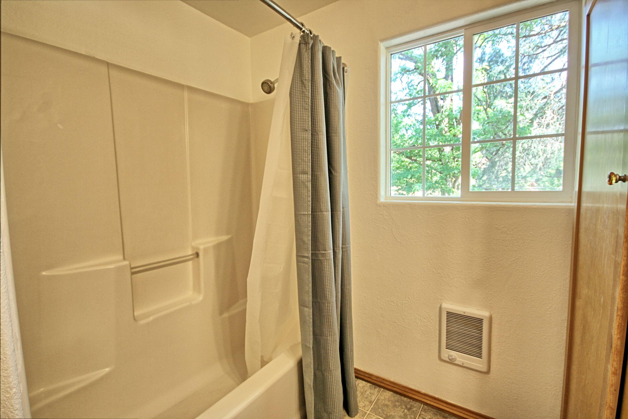199 Powell Creek Road Williams, OR 97544 - Photo 34 of 57 a bathroom with a shower and a window