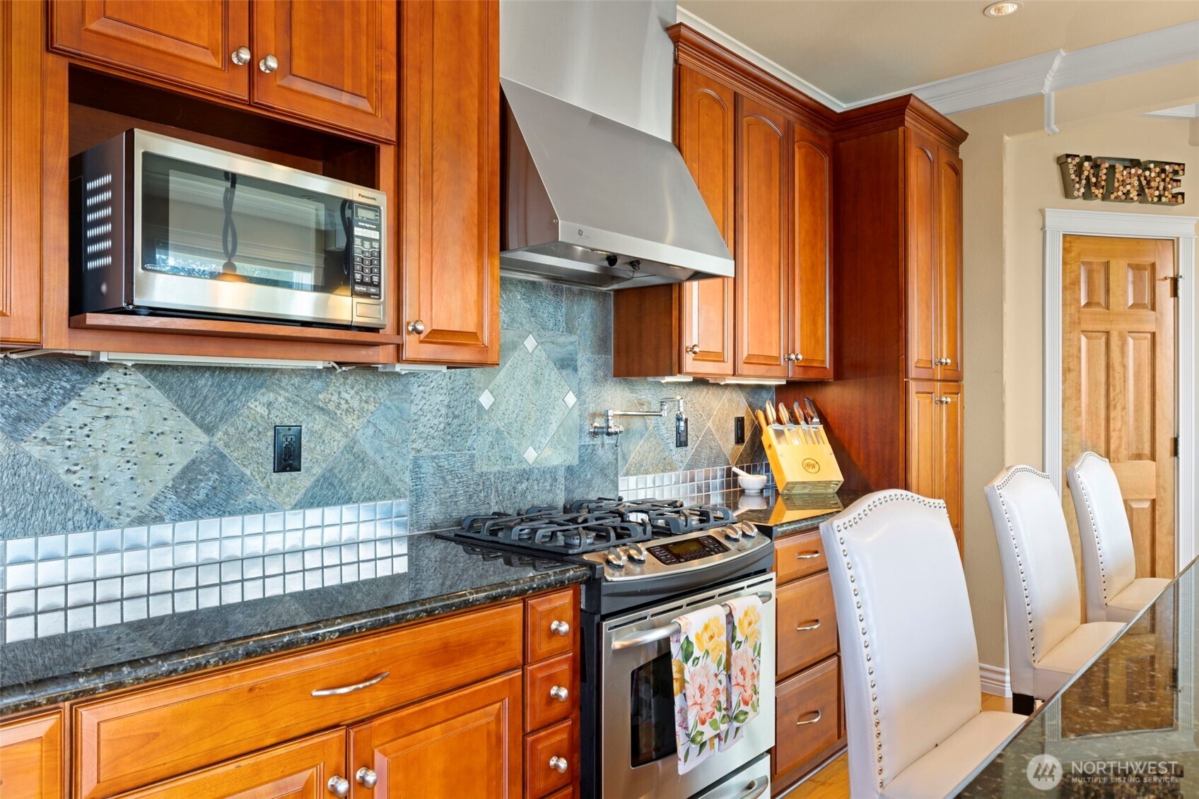 816 Walnut Street Edmonds, WA 98020 - Photo 15 of 32 a kitchen with stainless steel appliances granite countertop a stove and a microwave