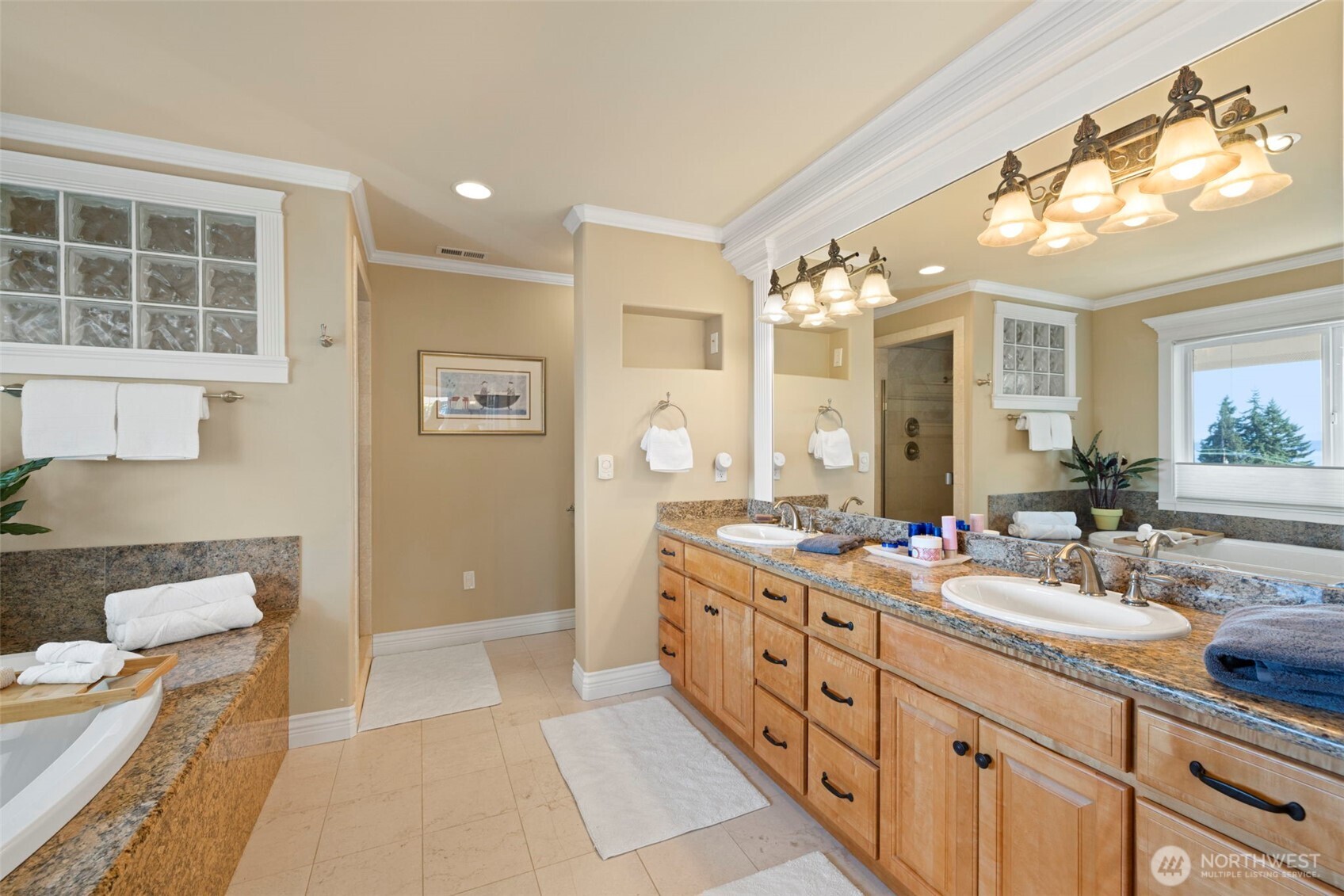816 Walnut Street Edmonds, WA 98020 - Photo 20 of 32 a spacious bathroom with double vanity a mirror and a shower