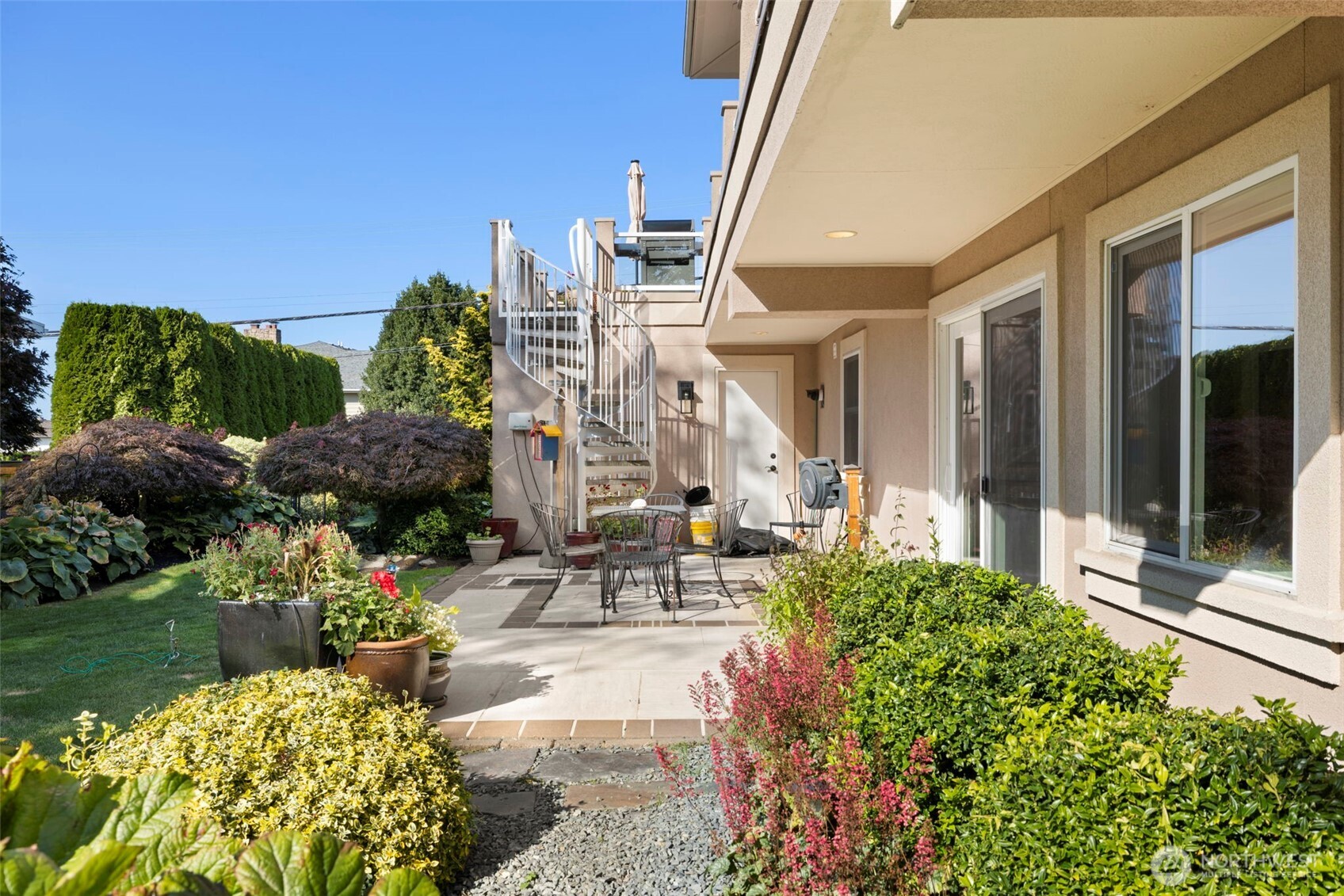 816 Walnut Street Edmonds, WA 98020 - Photo 27 of 32 a view of a chairs and table in a patio with potted plants