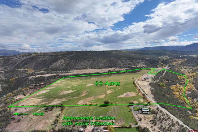 a view of a lake with a yard