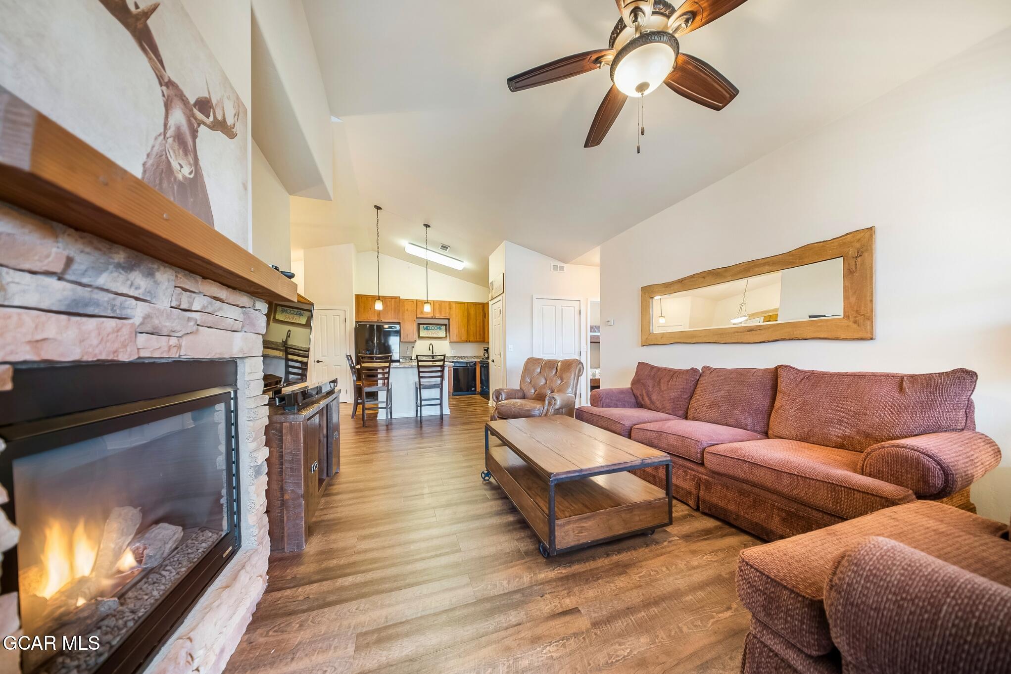162 Village Road, Unit G303 Granby, CO 80446 - Photo 8 of 37 a living room with furniture and a fireplace