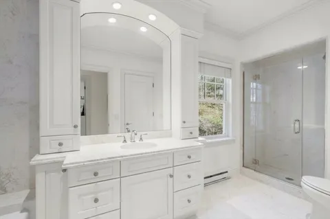 a bathroom with double sink and a mirror