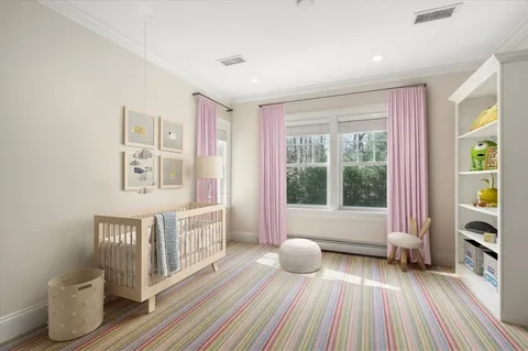 a spacious bedroom with a bed and wooden floor