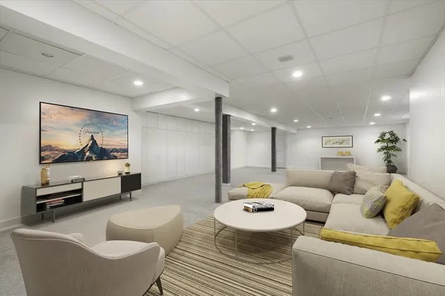 a living room with furniture and a table